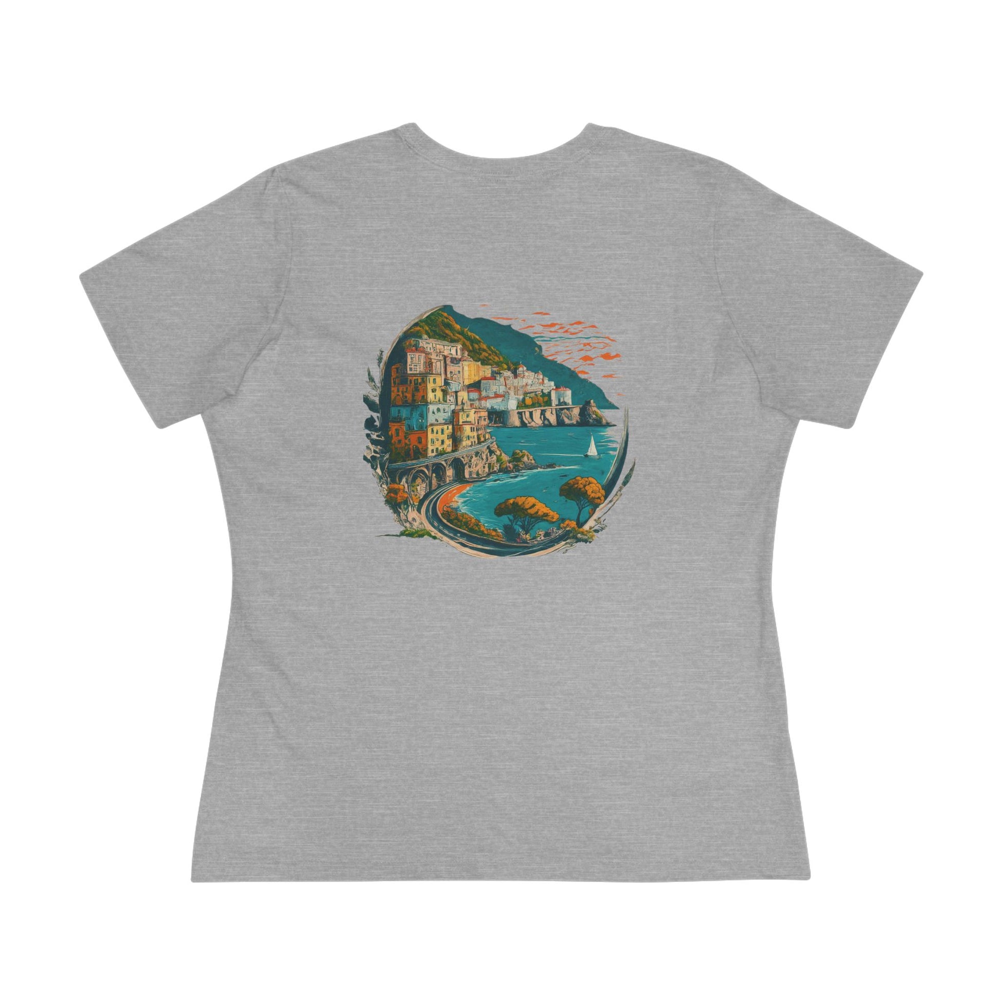 Gray t-shirt with a colorful graphic of a coastal town on a white background